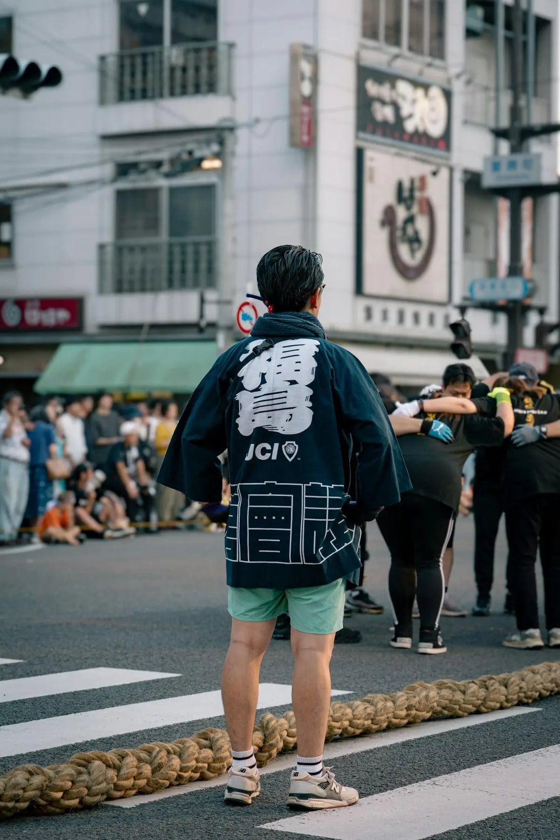 A man standing in the middle of a street